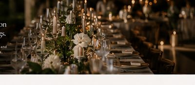 Outdoor wedding dinner setting under warm lights